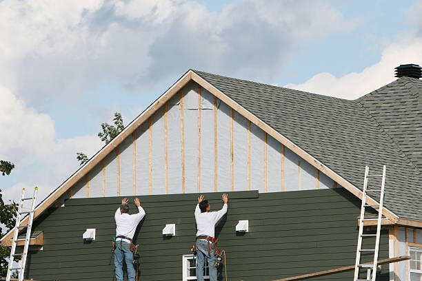 Professional Storm Damage Siding Repair technician working in Woodbine, MD